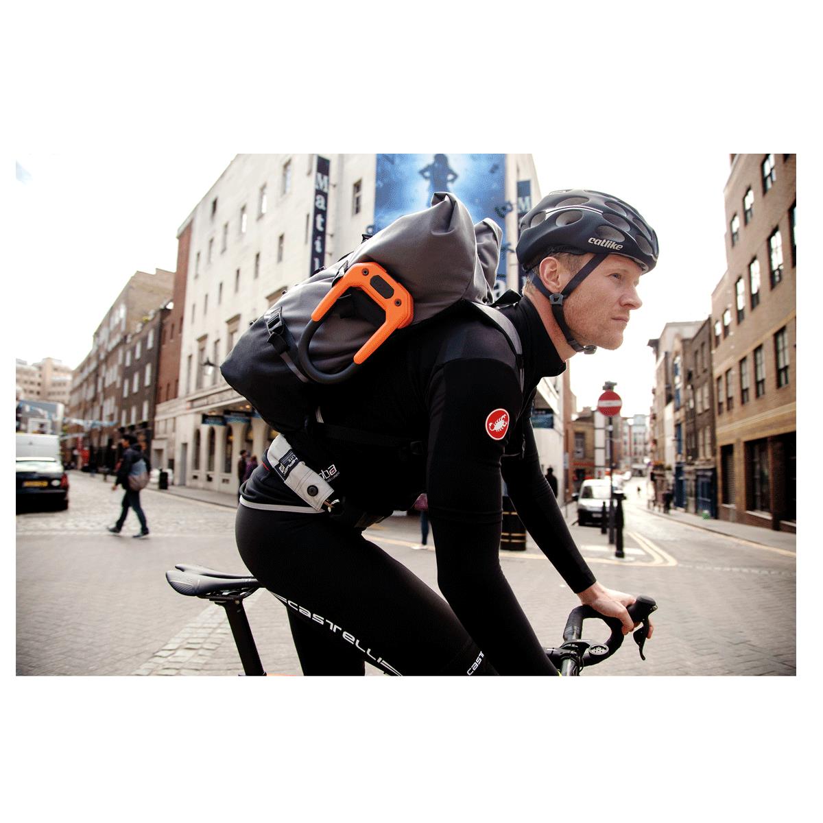 Hiplok DX attached to cyclist's bag strap