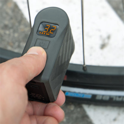 SKS EMP electric inflator connected to a bicycle tyre using the extension hose